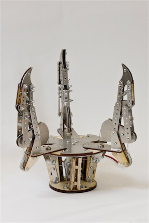 The finished hand in sheet metal and plywood, fingers open