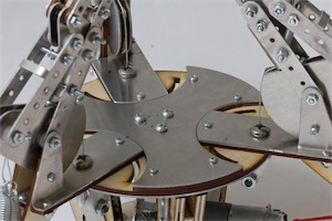 Close-up of the central sheet metal plate that redirects the cables outward